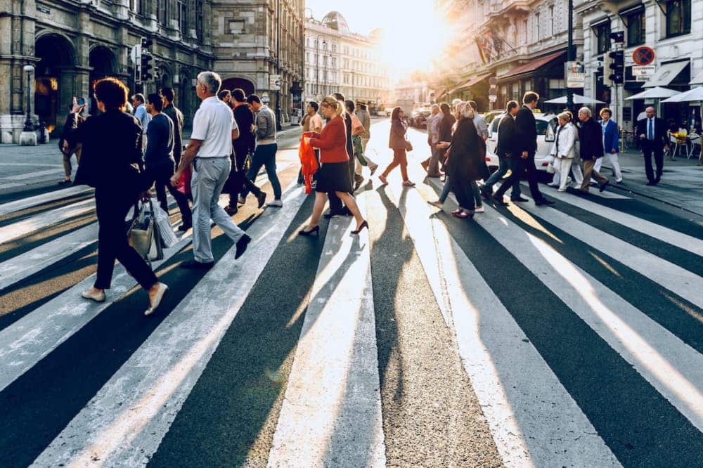 blockchain for tourism: people crossing a street