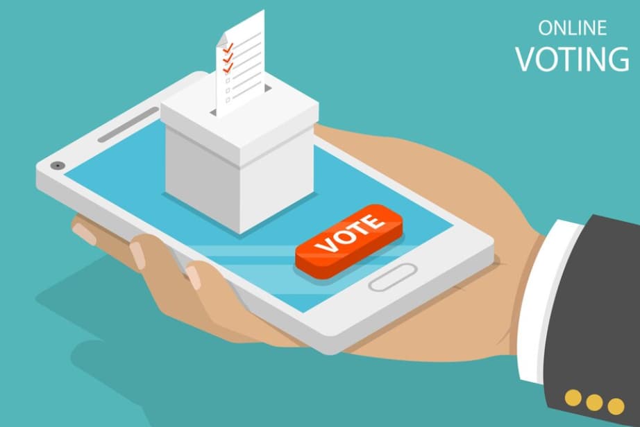 Blockchain benefits: hand holding a phone, with a box on it for inserting electoral folders.